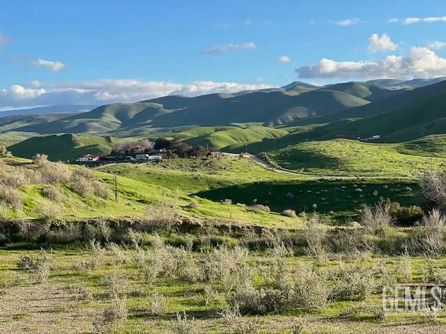 a view of a golf course with a lake
