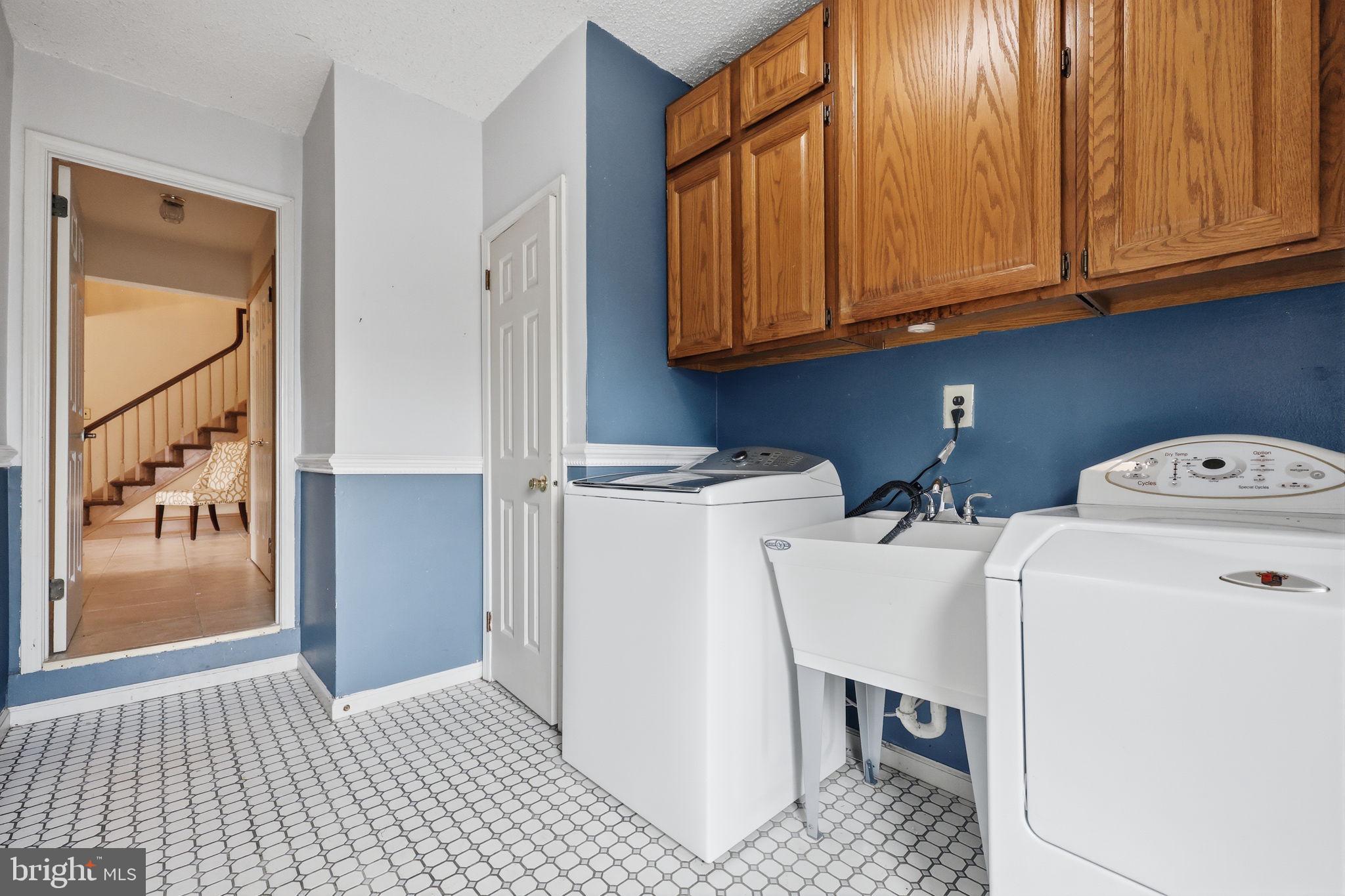 1140 Charter Road Warminster, PA 18974 - Photo 16 of 37 Bright laundry room with stylish tiles.