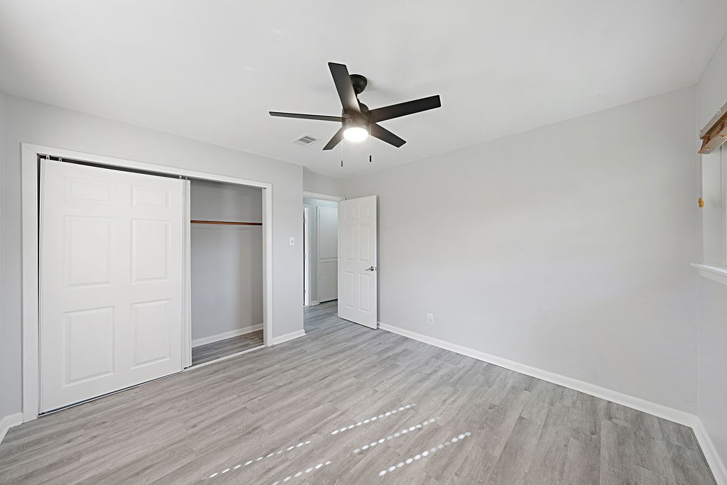 614 Gilpin Street Houston, TX 77034 - Photo 16 of 27 Discover the inviting tranquility of the third bedroom with updated flooring and fresh paint.