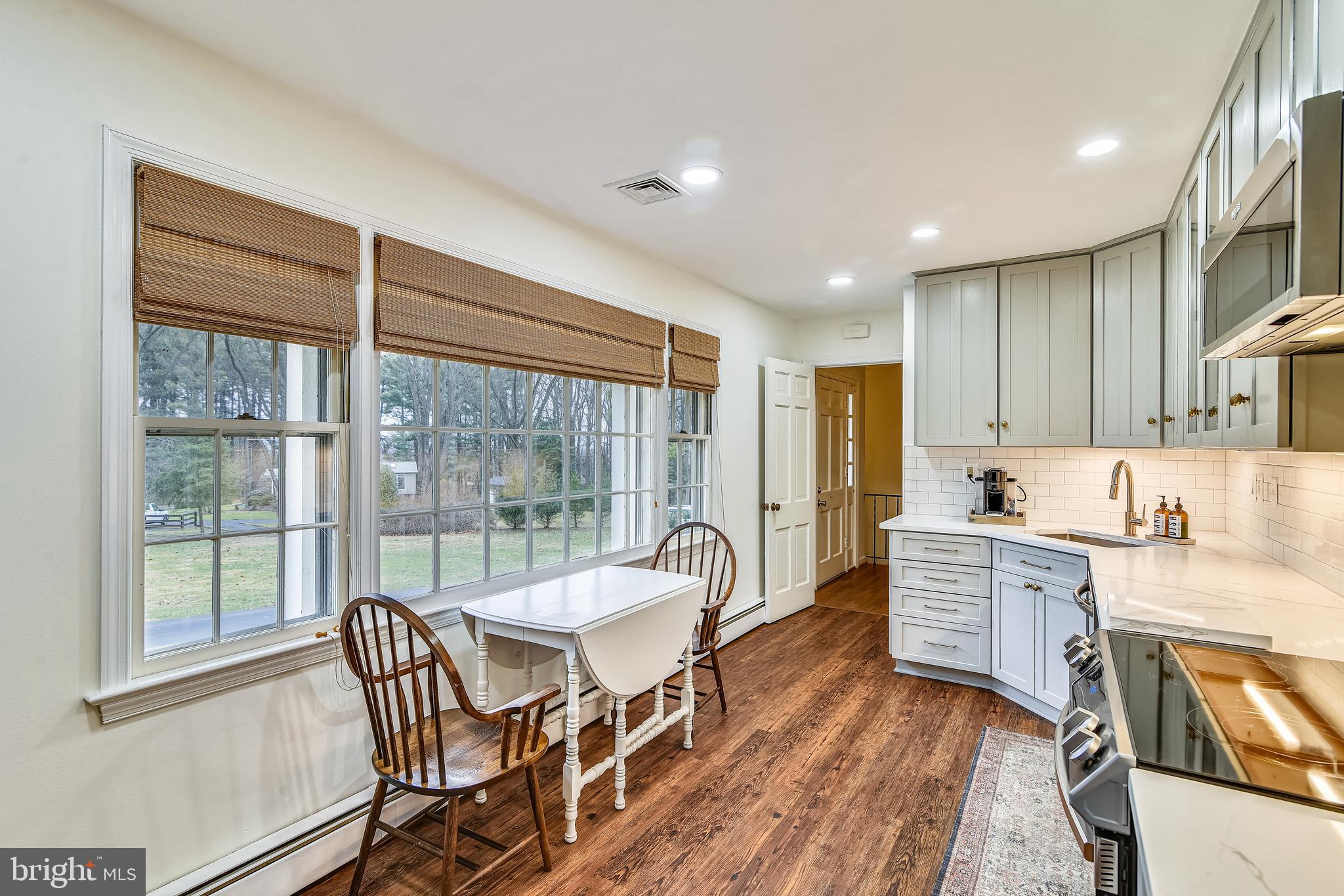 19366 Loudoun Orchard Road Leesburg, VA 20175 - Photo 12 of 40 Wall of windows highlight new kitchen flooring
