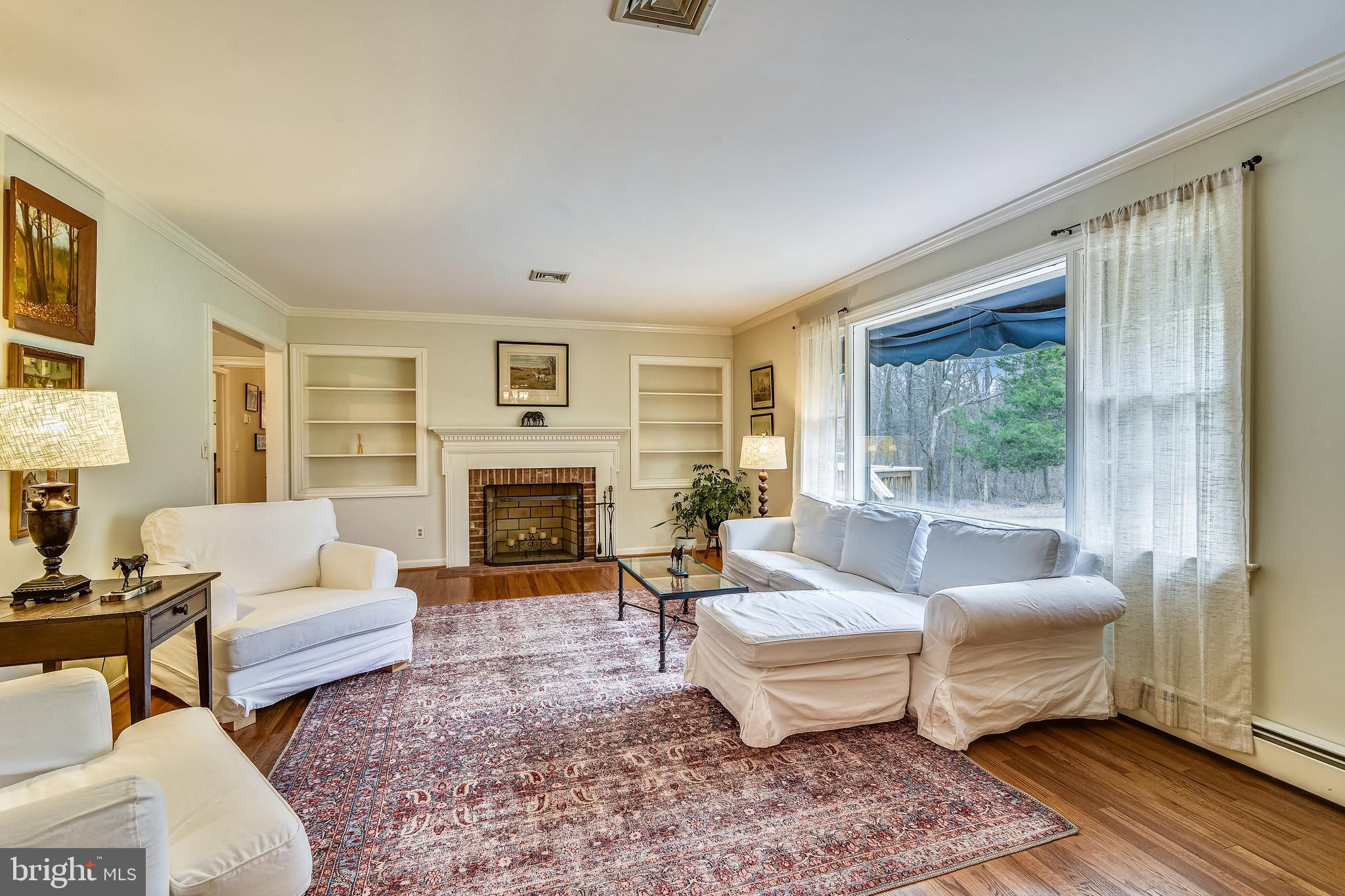 19366 Loudoun Orchard Road Leesburg, VA 20175 - Photo 15 of 40 Classic built-ins frame the handsome fireplace