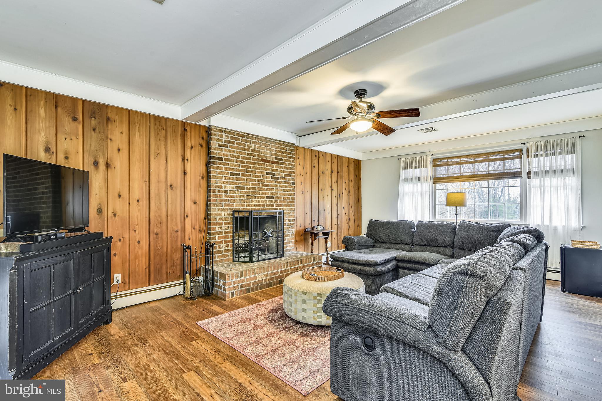 19366 Loudoun Orchard Road Leesburg, VA 20175 - Photo 17 of 40 New flooring in GR with stone fireplace and hearth