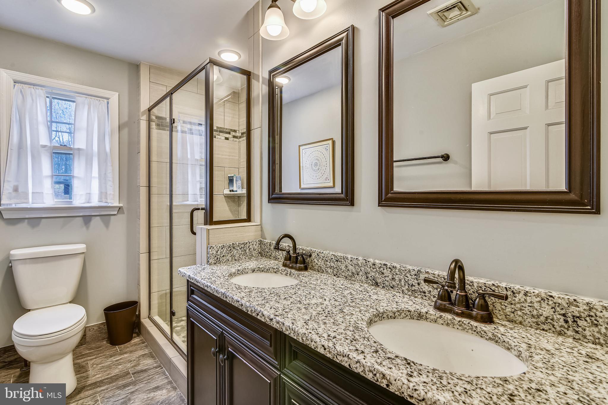 19366 Loudoun Orchard Road Leesburg, VA 20175 - Photo 25 of 40 Remodeled bath with granite dual vanities