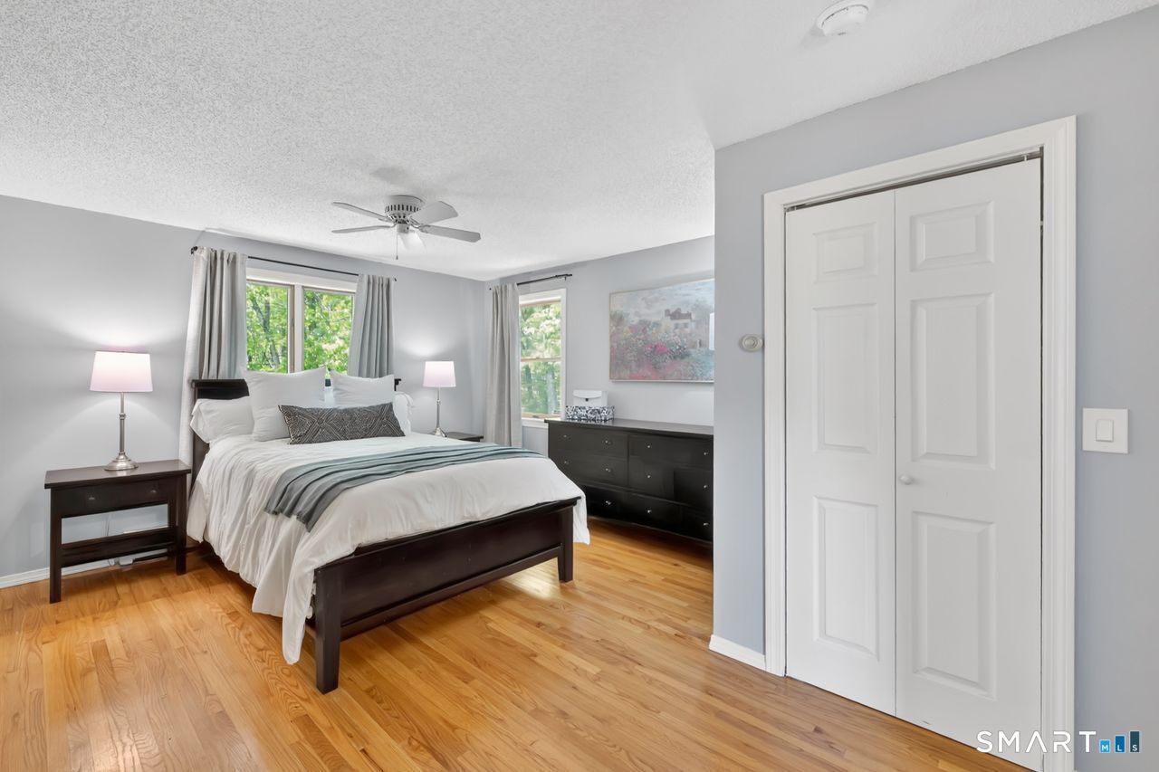 1013 Ratley Road Suffield, CT 06093 - Photo 28 of 39 a bedroom with a bed and a night stand
