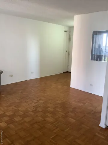 an empty room with a bathroom