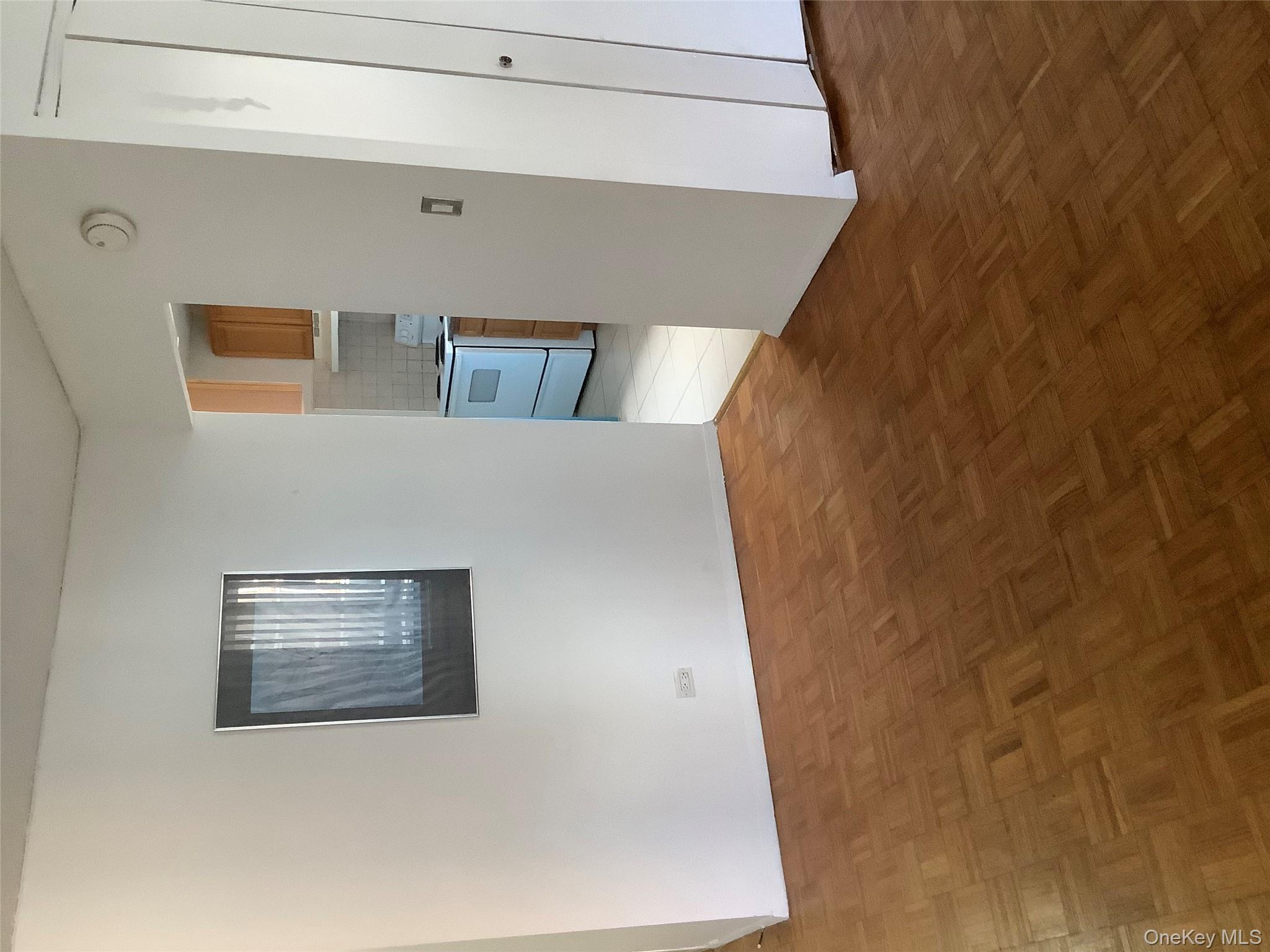 138-35 Elder Avenue, Unit 9DA Queens, NY 11355 - Photo 3 of 9 a view of an empty room and closet area