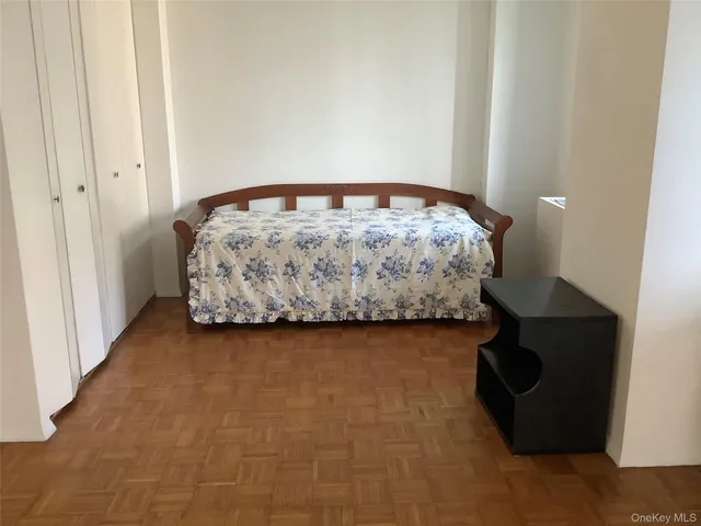 a bedroom with a bed and a table