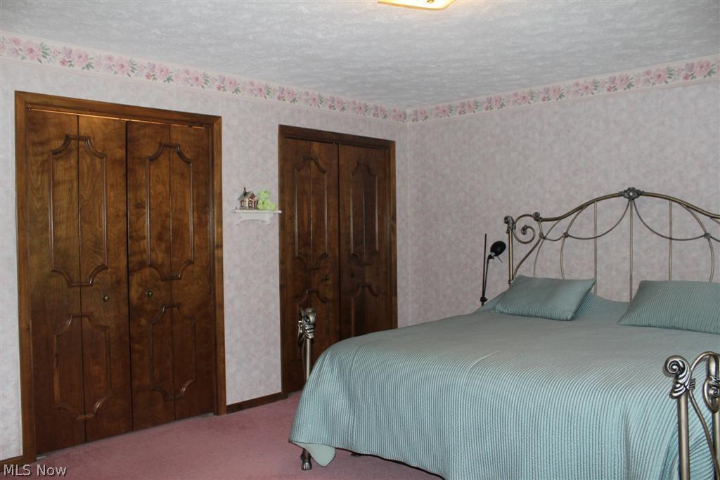 1815 Spring Valley Avenue Northwest Canton, OH 44708 - Photo 17 of 24 Bedroom 3 is carpeted and has double closets.