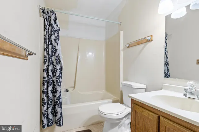 a bathroom with a sink a toilet and a bathtub