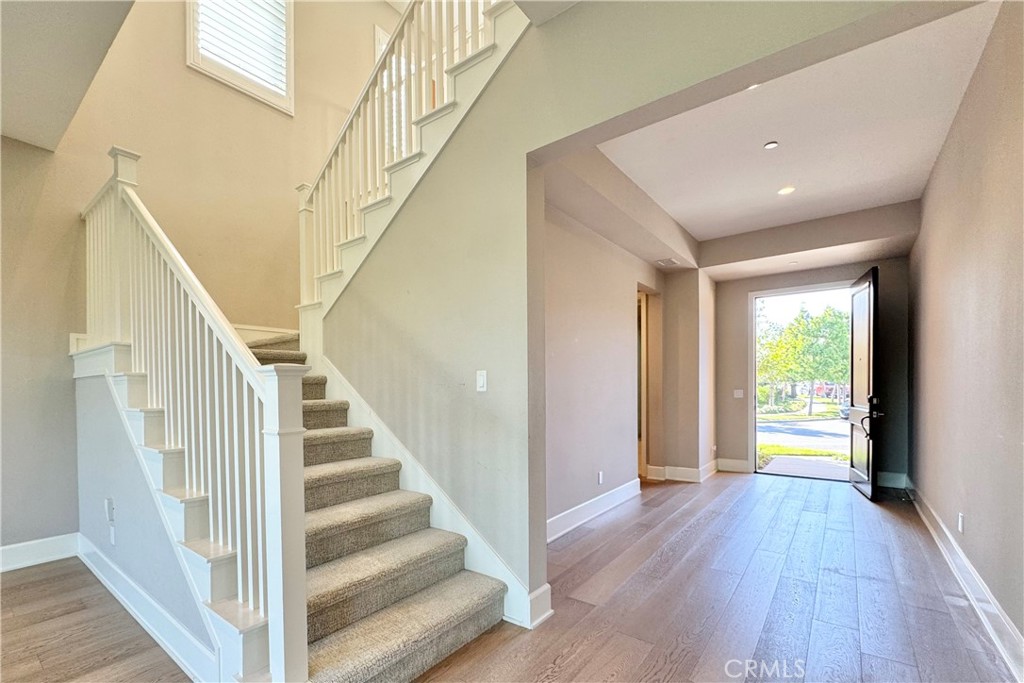 115 Locanda Irvine, CA 92602 - Photo 11 of 28 a view of entryway with wooden floor and stair