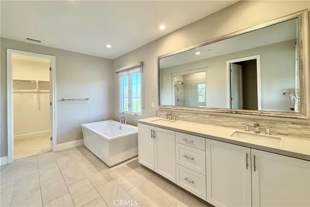 a bathroom with a tub and shower