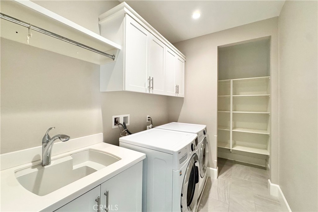 115 Locanda Irvine, CA 92602 - Photo 24 of 28 a utility room with dryer and washer