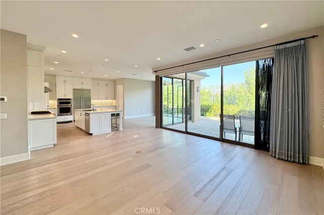 a view of large kitchen with large windows