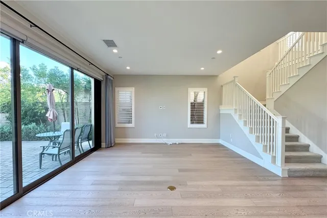 a view of an entryway with wooden floor