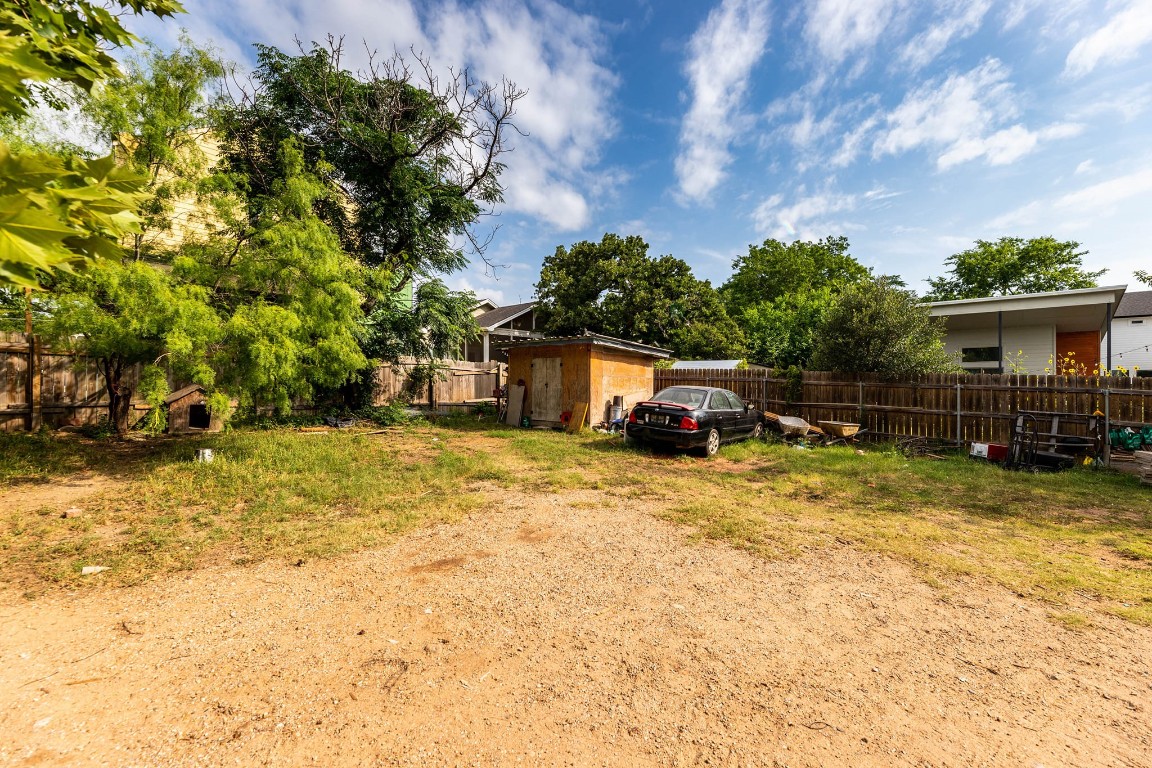 1144 Mason Avenue Austin, TX 78721 - Photo 15 of 37 a backyard of a house with table and chairs