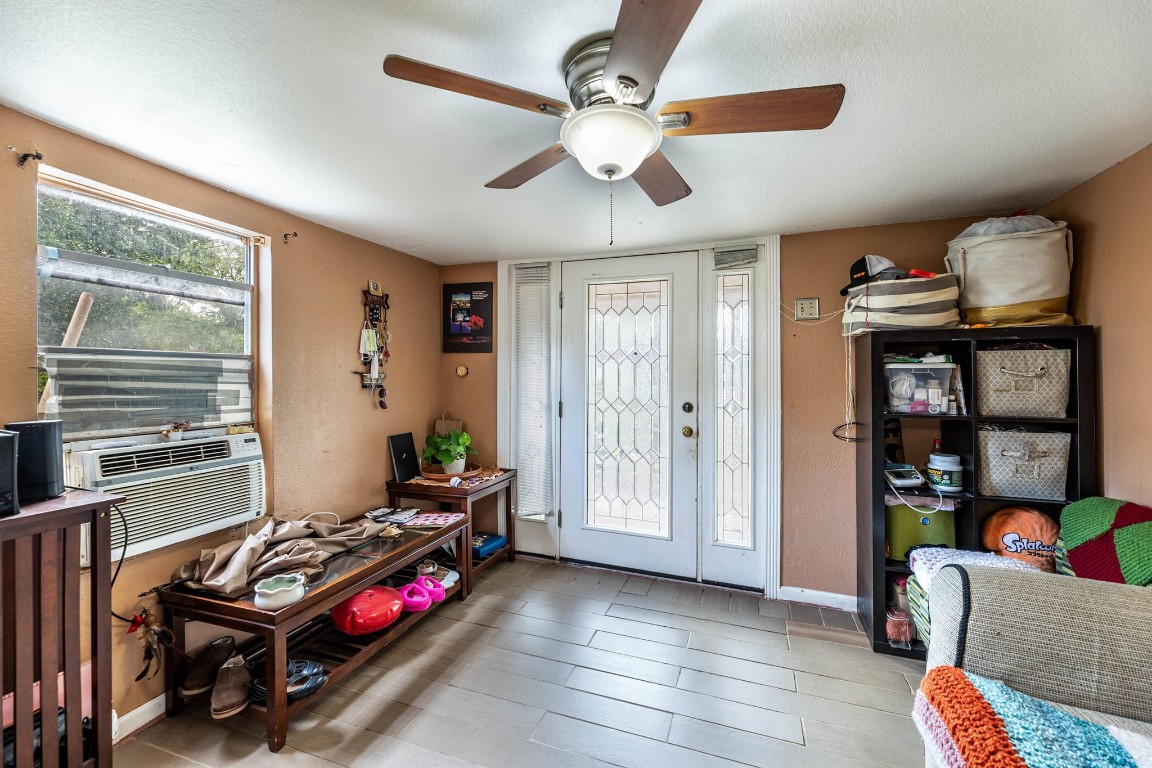1144 Mason Avenue Austin, TX 78721 - Photo 16 of 37 a bedroom with furniture and a chandelier