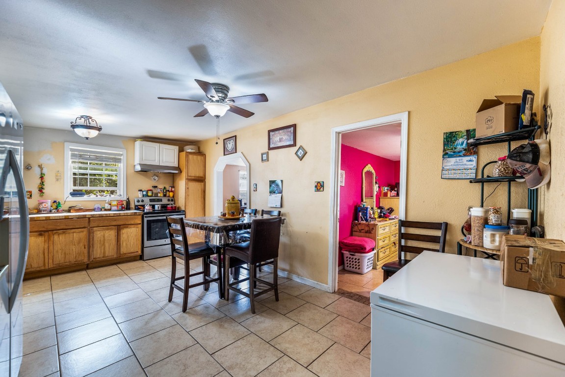 1144 Mason Avenue Austin, TX 78721 - Photo 24 of 37 a view of a dining room with furniture and chandelier