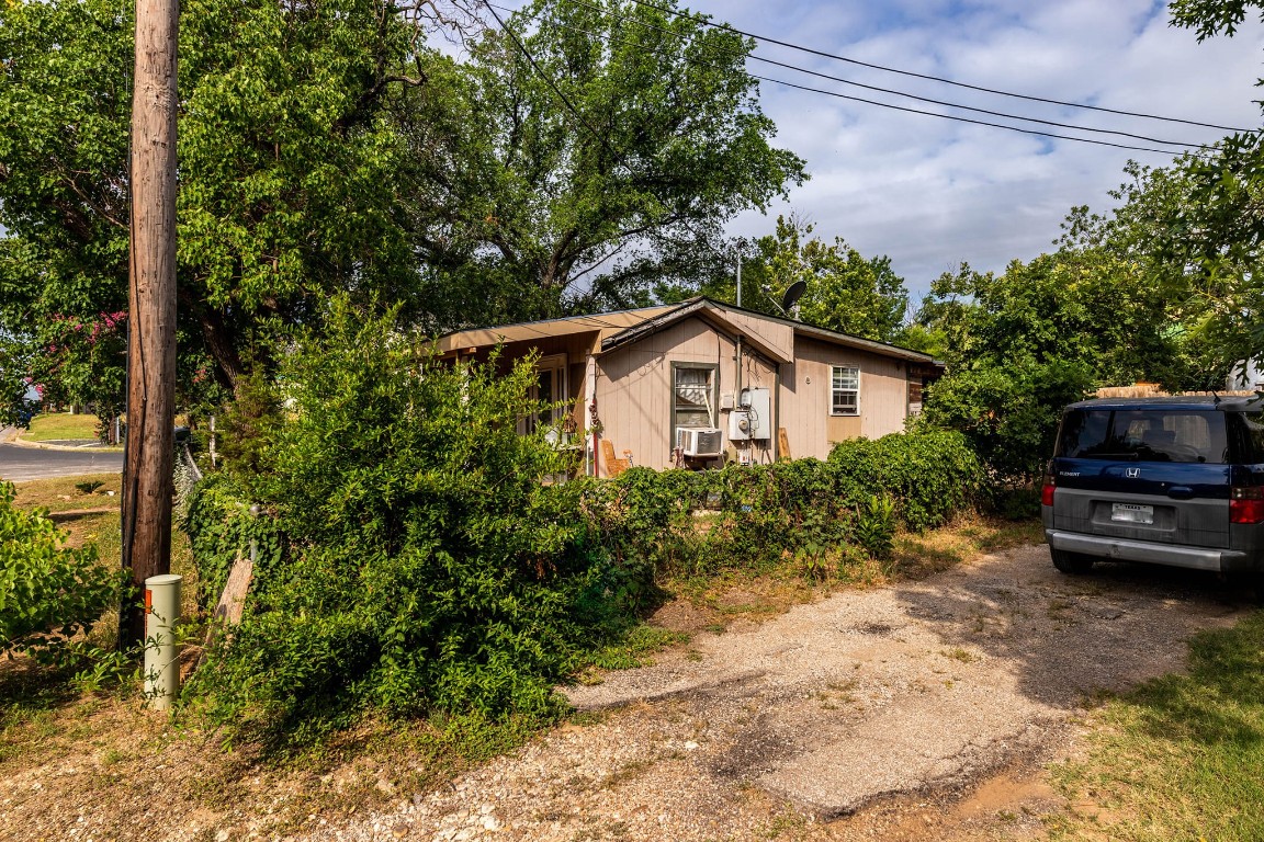 1144 Mason Avenue Austin, TX 78721 - Photo 36 of 37 a view of a house with a small yard plants and large tree