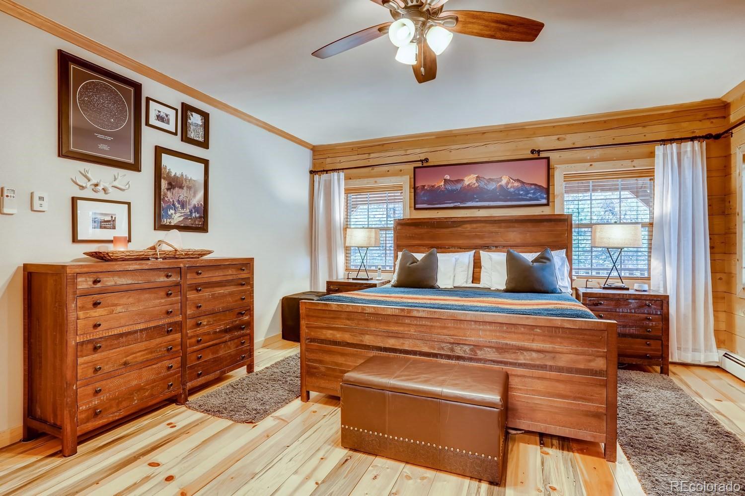 13380 South Foxton Road Conifer, CO 80433 - Photo 18 of 40 a room with furniture and paintings on the wall