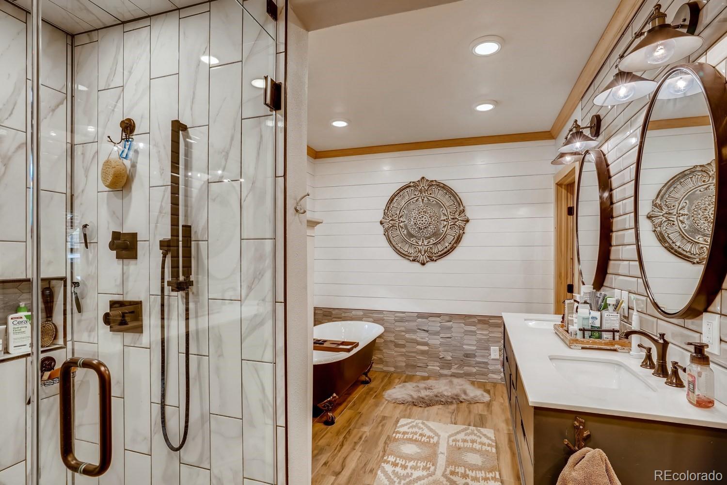 13380 South Foxton Road Conifer, CO 80433 - Photo 19 of 40 a bathroom with a sink and a mirror
