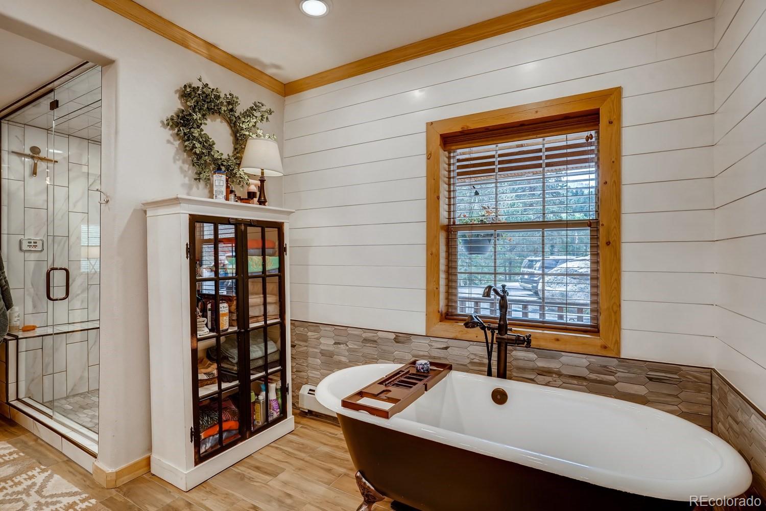 13380 South Foxton Road Conifer, CO 80433 - Photo 21 of 40 a bathroom with a sink and a window