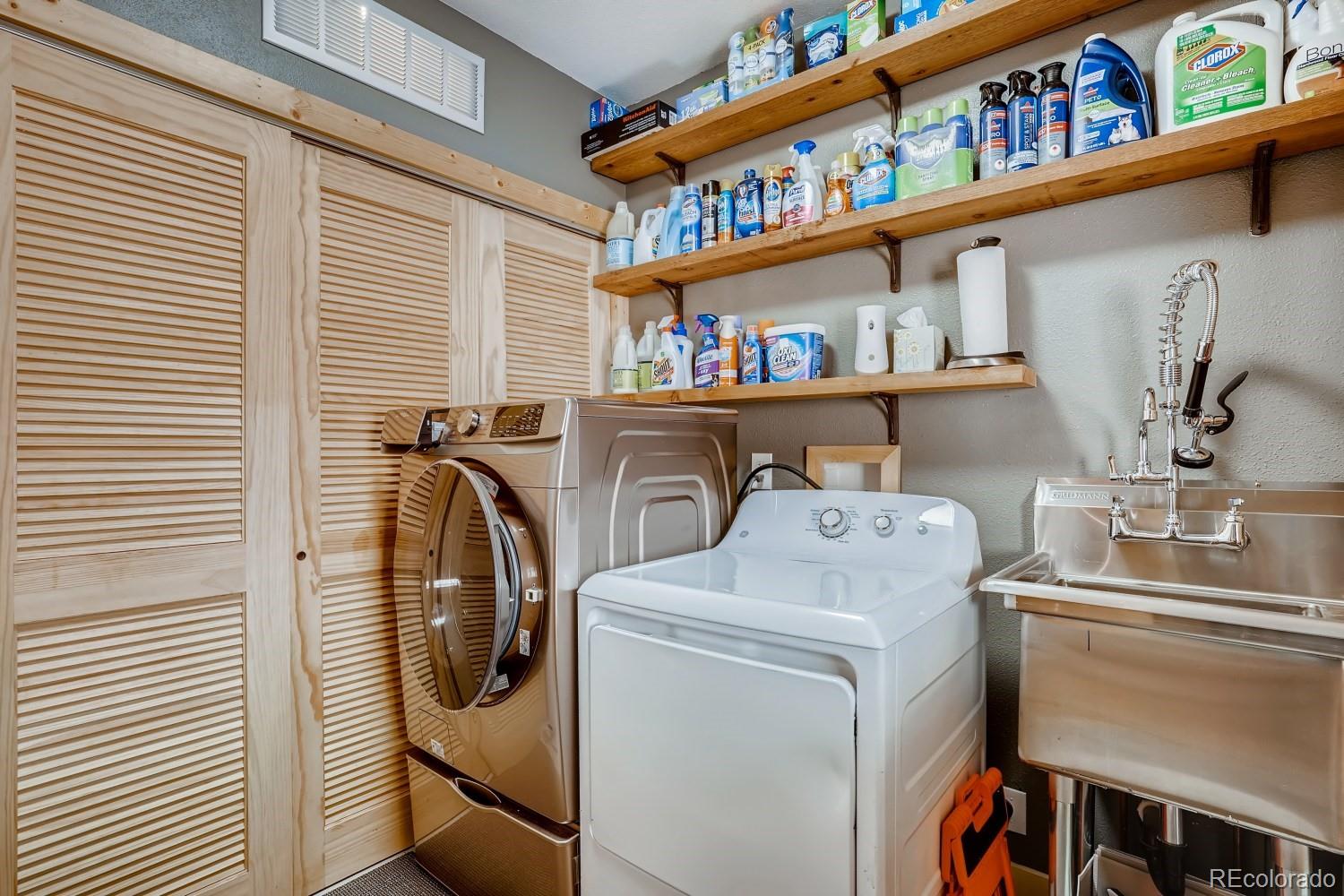 13380 South Foxton Road Conifer, CO 80433 - Photo 23 of 40 a utility room with dryer and washer