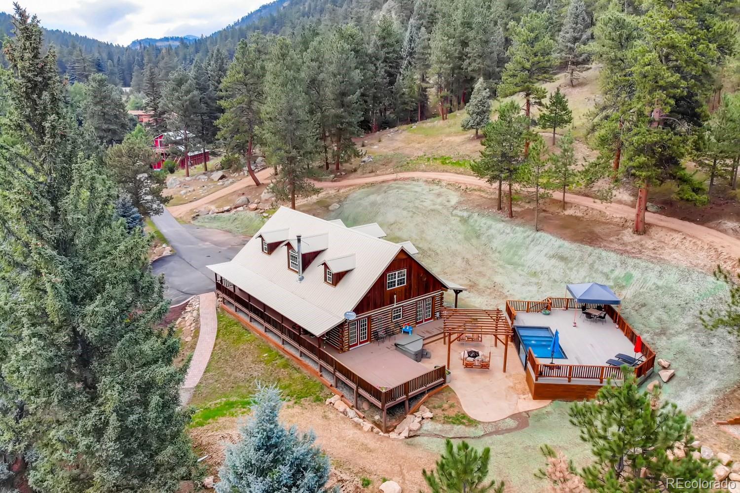 13380 South Foxton Road Conifer, CO 80433 - Photo 3 of 40 an aerial view of a house with a yard