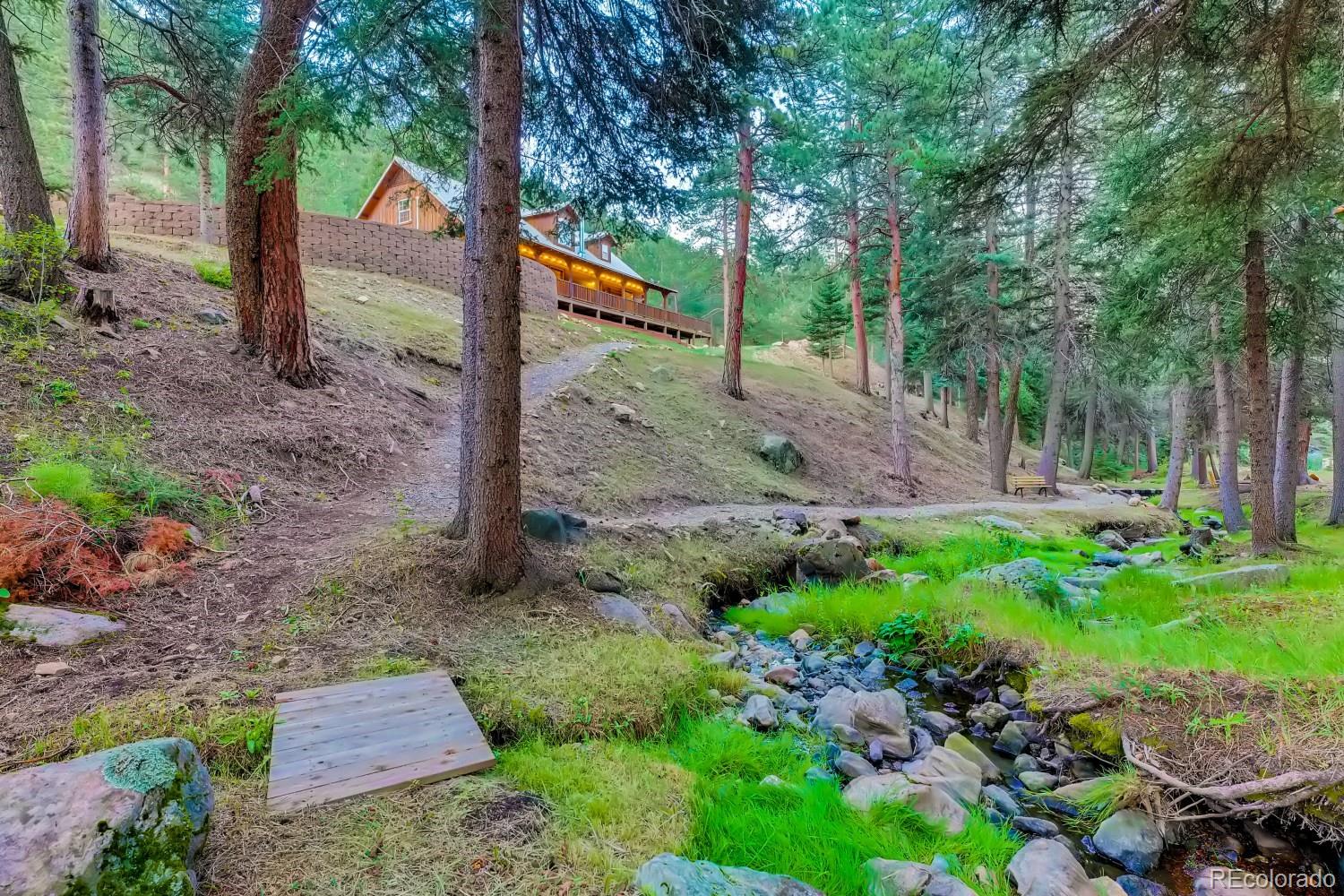 13380 South Foxton Road Conifer, CO 80433 - Photo 5 of 40 a view of a park that has large trees