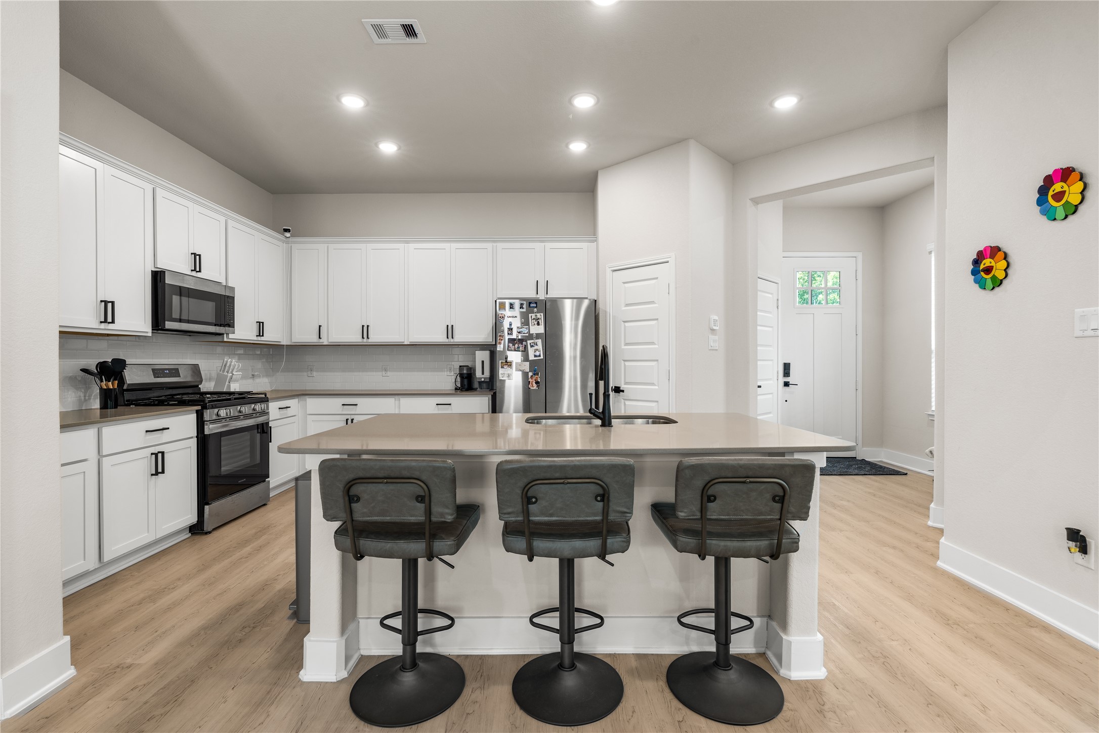 4001 Baja Lane Houston, TX 77045 - Photo 4 of 27 Designed to keep everyday life connected, the main living spaces flow seamlessly together, allowing conversation, meal preparation, and gathering to happen naturally from the moment you walk through the door.
