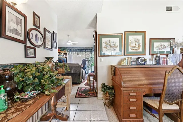 a living room with fireplace furniture and a window