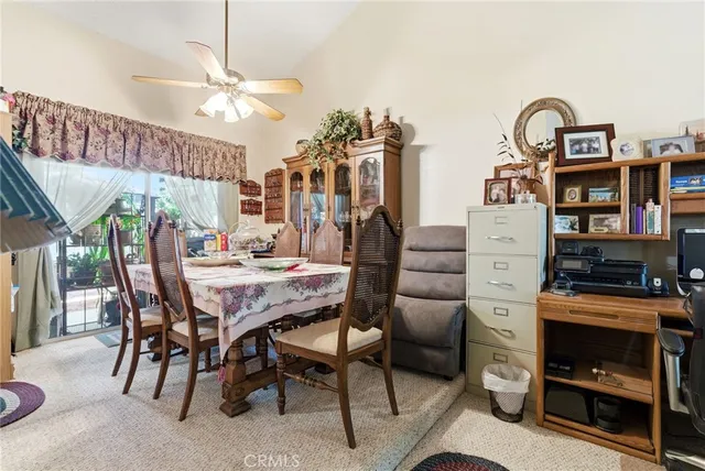 a dining room with furniture and chandelier