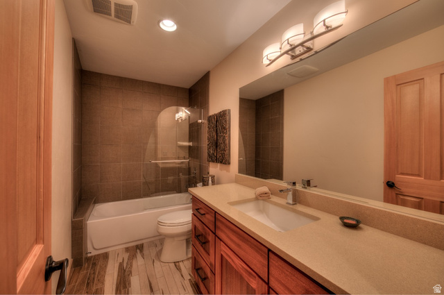 425 Amber Lane Moab, UT 84532 - Photo 14 of 27 Bathroom with vanity, shower / bath combination, recessed lighting, and light wood-type flooring