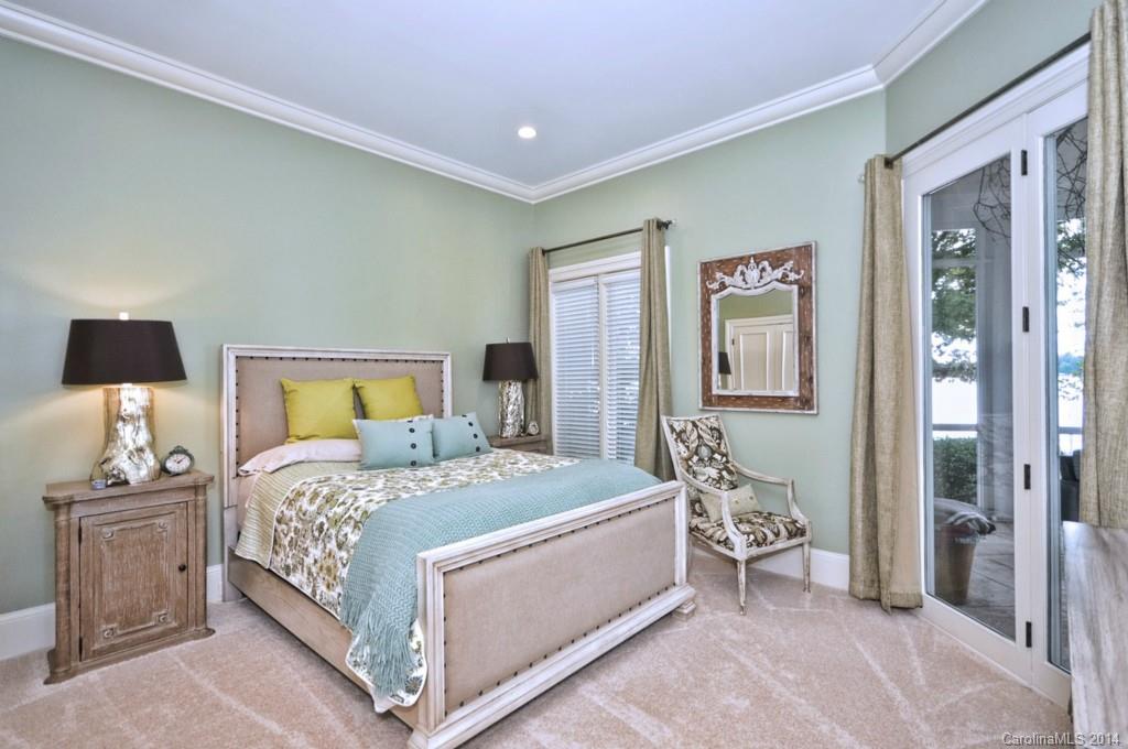 18301 Bowsprit Pointe Road Cornelius, NC 28031 - Photo 14 of 24 a bedroom with a bed and a table in it