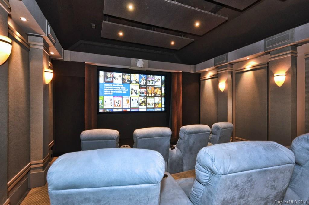 18301 Bowsprit Pointe Road Cornelius, NC 28031 - Photo 17 of 24 a media room with lots of chairs and a projector screen