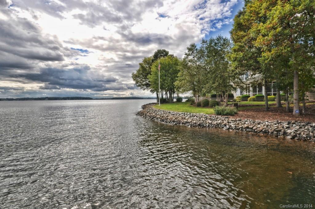 18301 Bowsprit Pointe Road Cornelius, NC 28031 - Photo 23 of 24 a view of a lake with a big yard