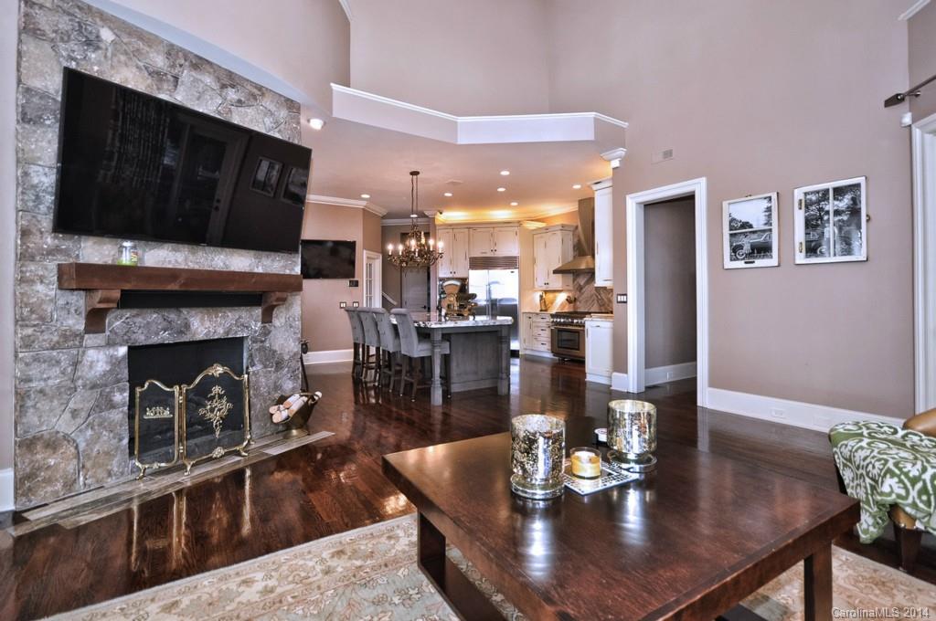 18301 Bowsprit Pointe Road Cornelius, NC 28031 - Photo 9 of 24 a living room with fireplace furniture and a flat screen tv