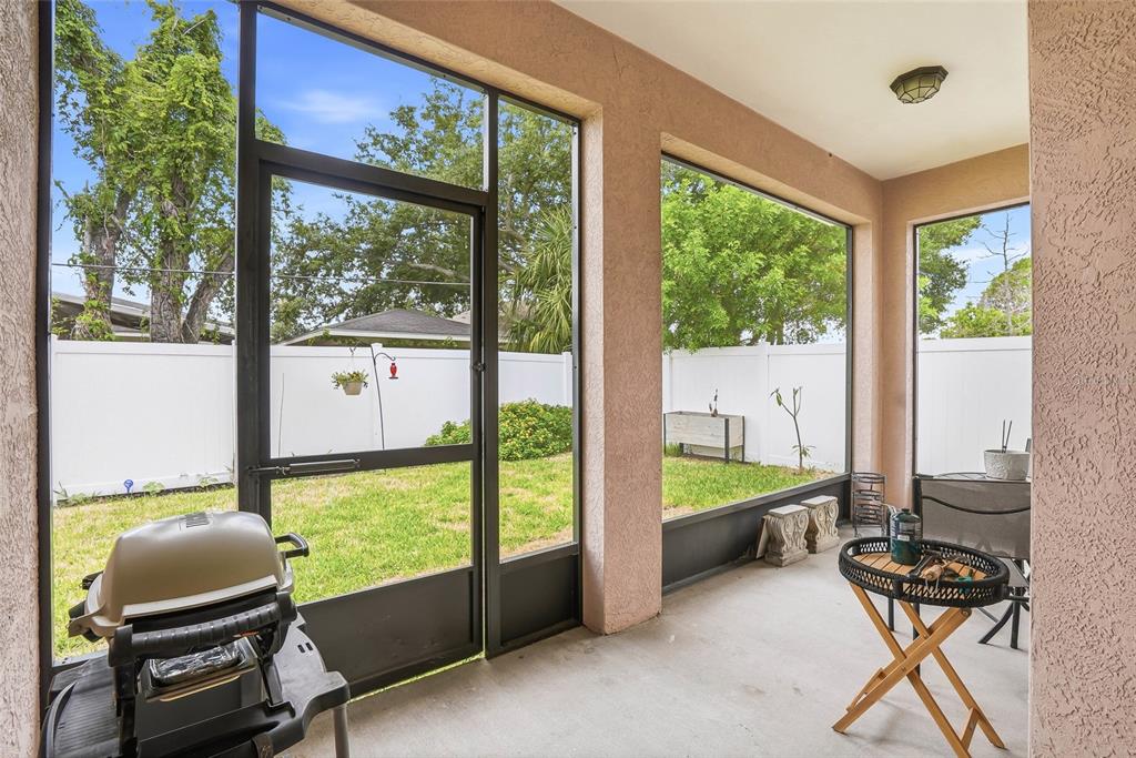 2906 West Douglas Street Tampa, FL 33607 - Photo 25 of 36 a balcony with couple of chairs and a table