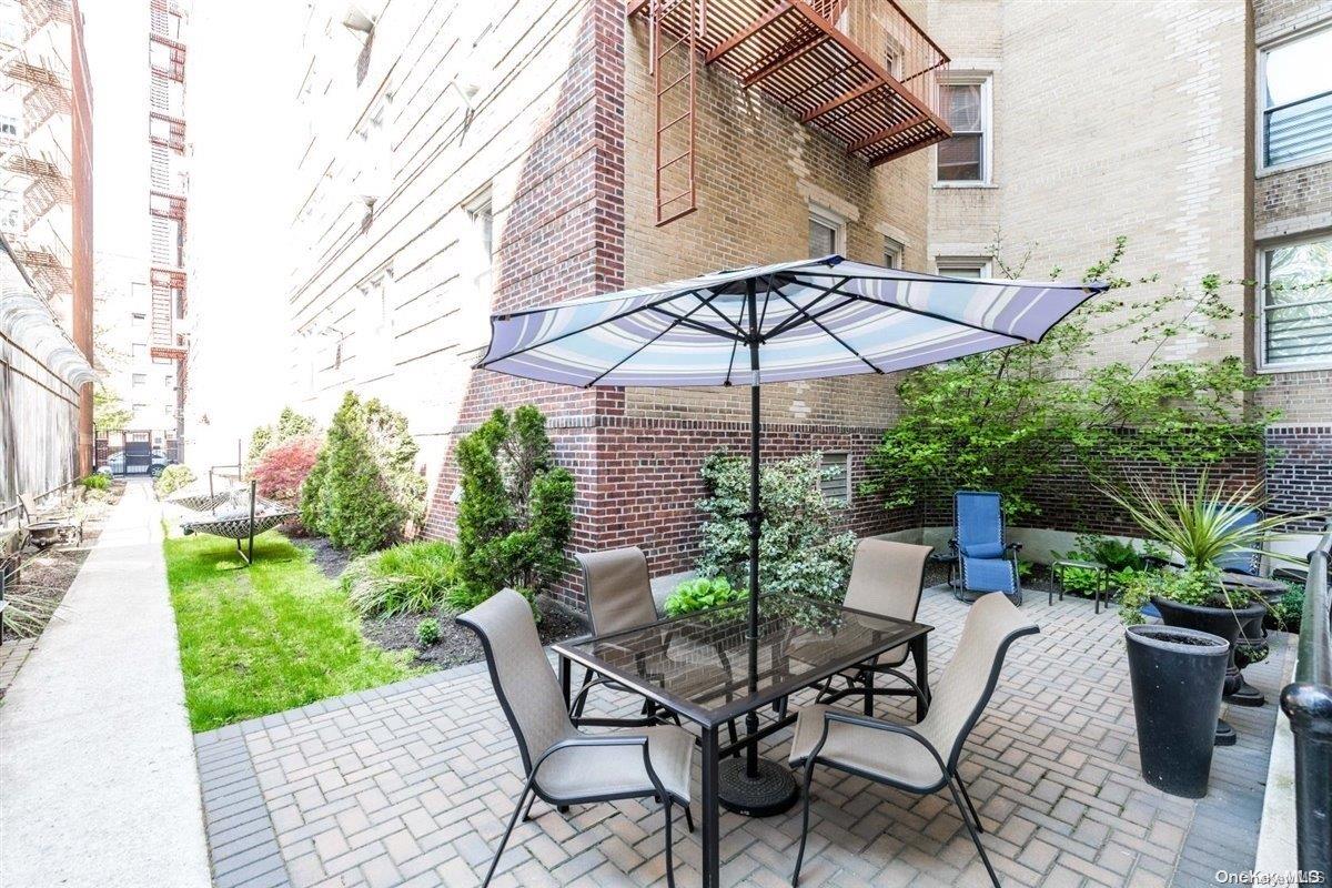 76-12 35th Avenue, Unit 2D Queens, NY 11372 - Photo 11 of 13 Backyard Seating Area