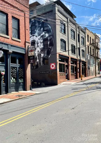 a view of a building with a street
