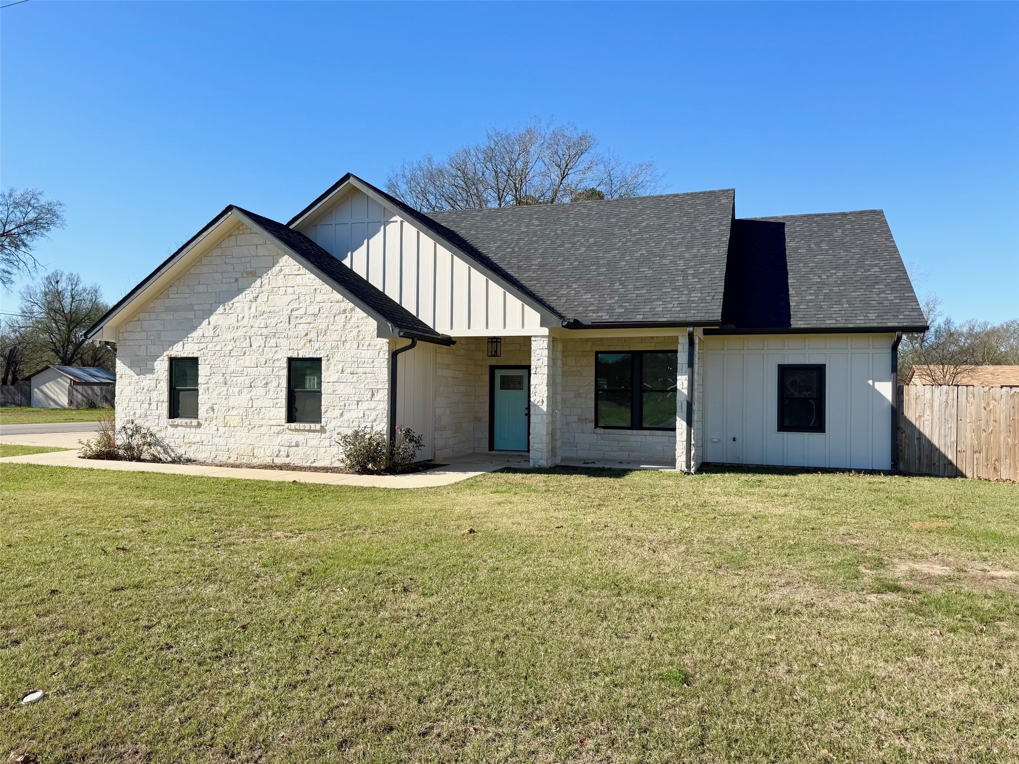 a house with yard in front of it