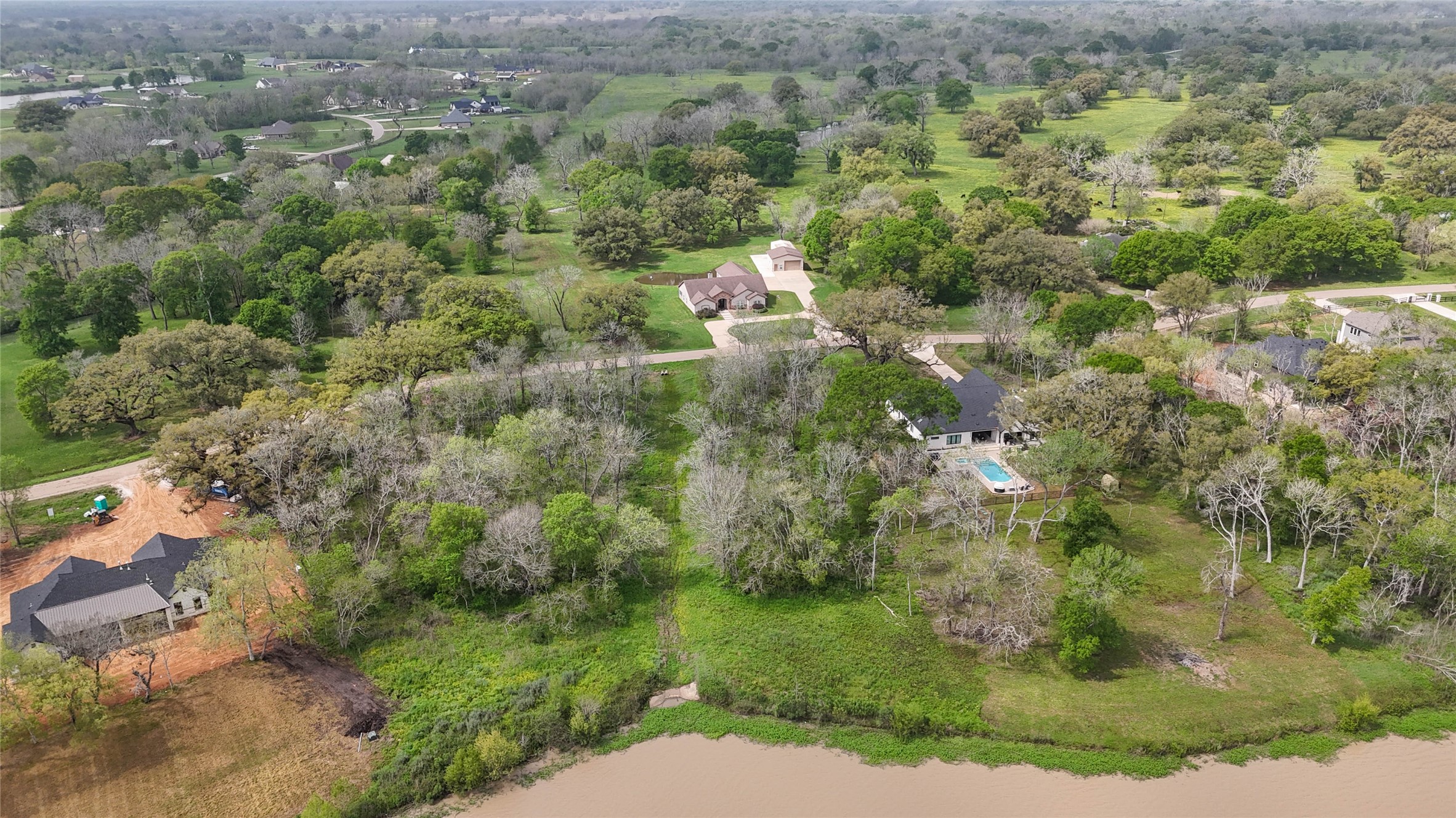 21502 Chenango Lake Drive Angleton, TX 77515 - Photo 12 of 18 an aerial view of residential houses with outdoor space and trees