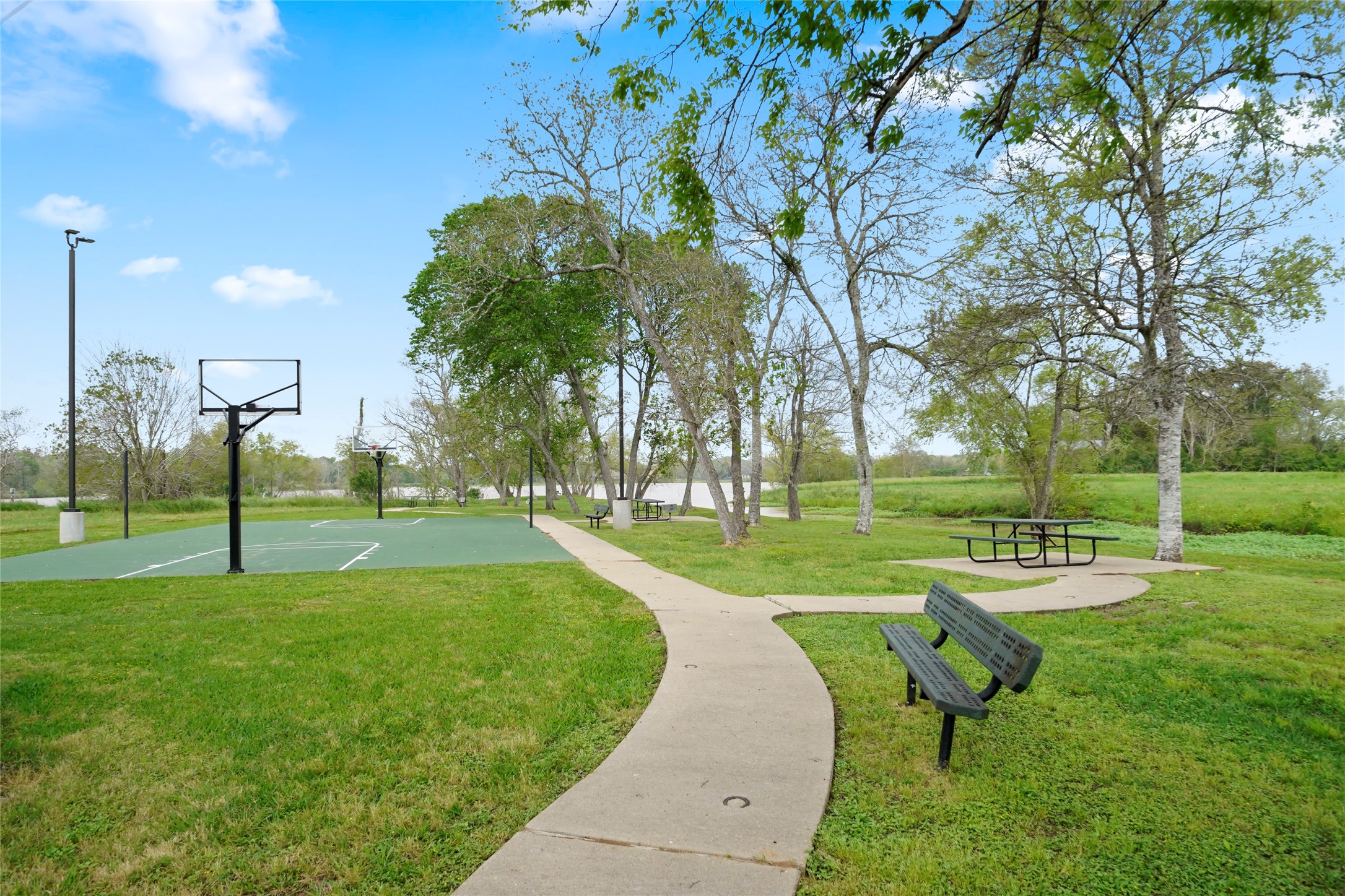 21502 Chenango Lake Drive Angleton, TX 77515 - Photo 16 of 18 a view of a park with swings