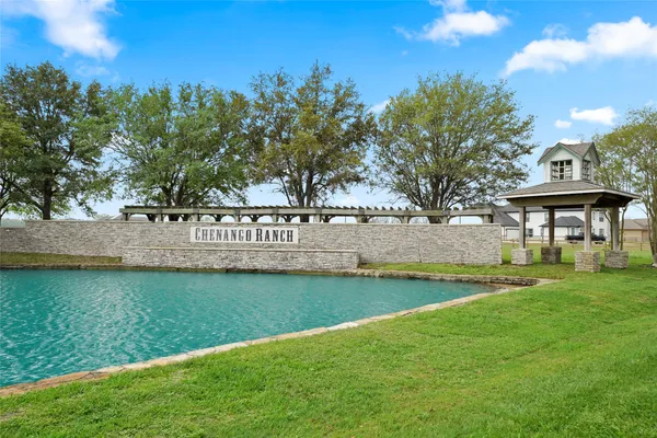a view of a lake with houses in the back