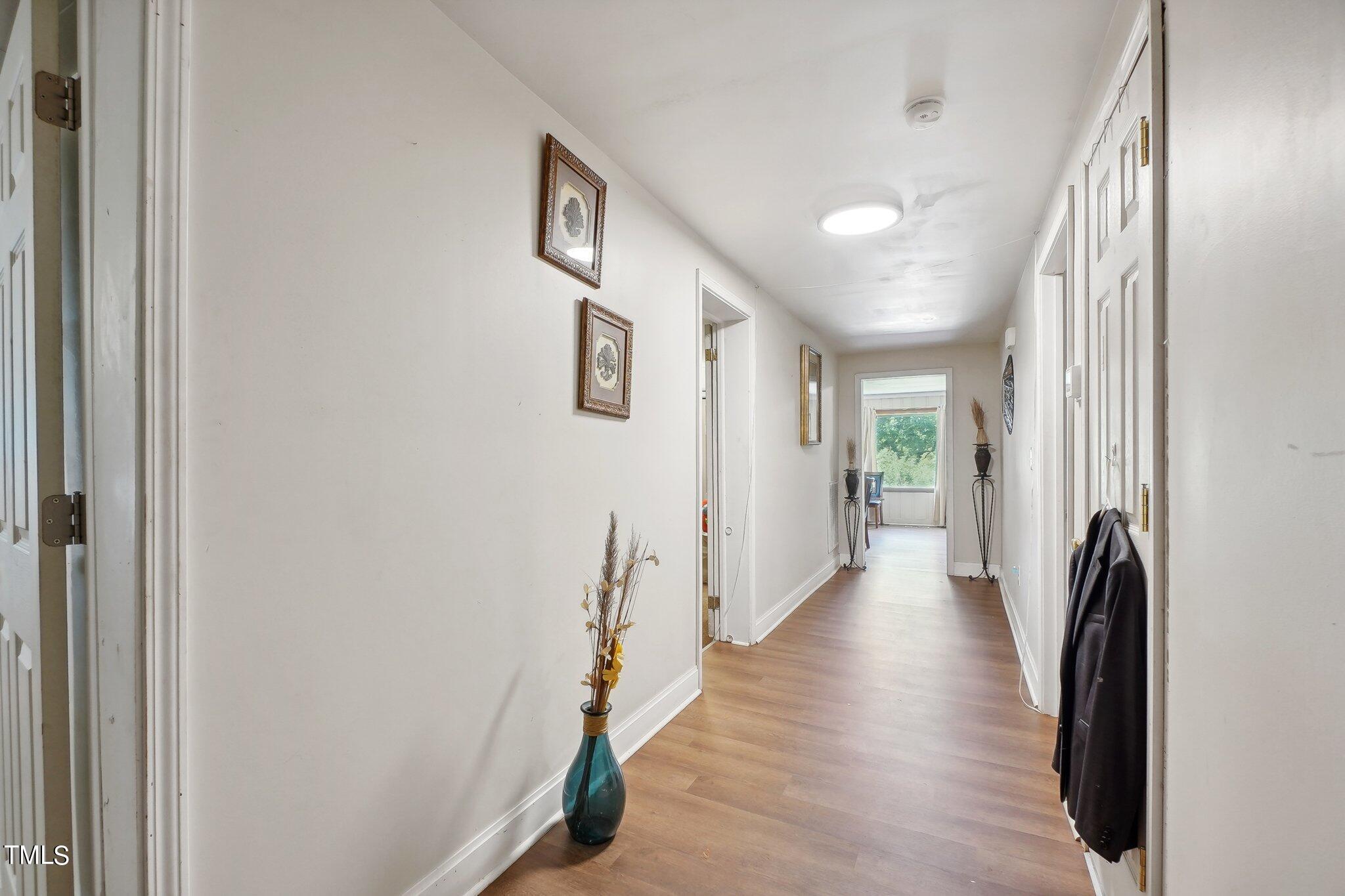 425 Kittrell Road Kittrell, NC 27544 - Photo 29 of 69 a view of a hallway with wooden floor and staircase