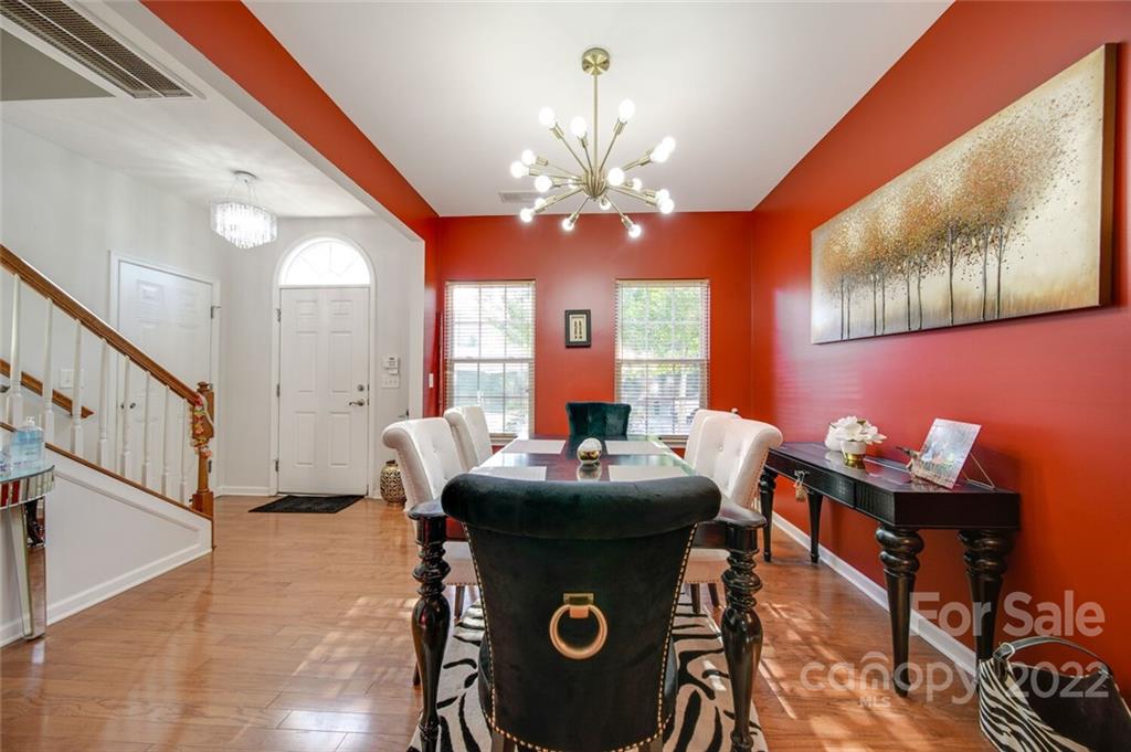 727 Prospect Lane Fort Mill, SC 29708 - Photo 4 of 43 a dining room with furniture and a chandelier
