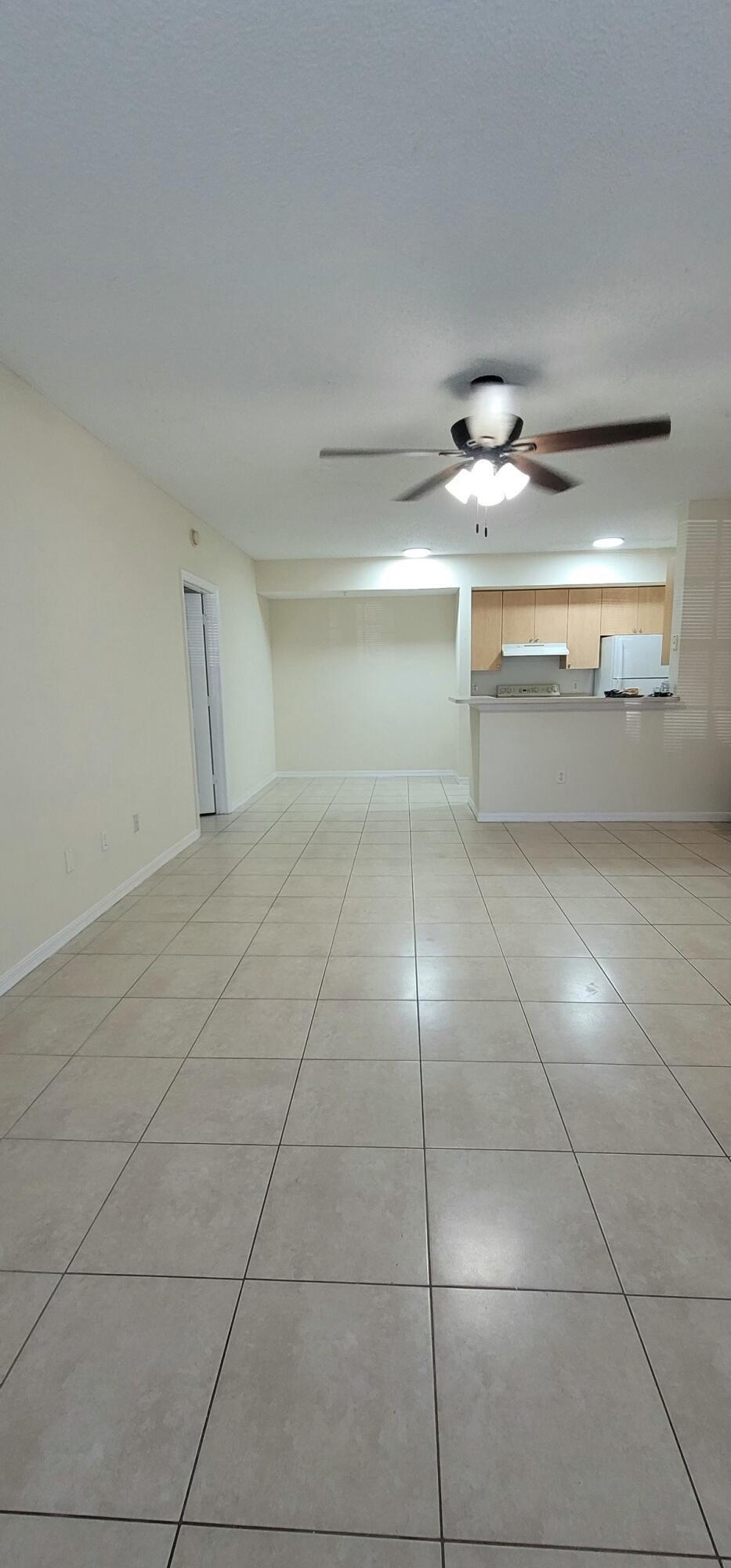 5032 Lantana Road, Unit 2105 Lake Worth, FL 33463 - Photo 6 of 15 a view of a refrigerator in a room