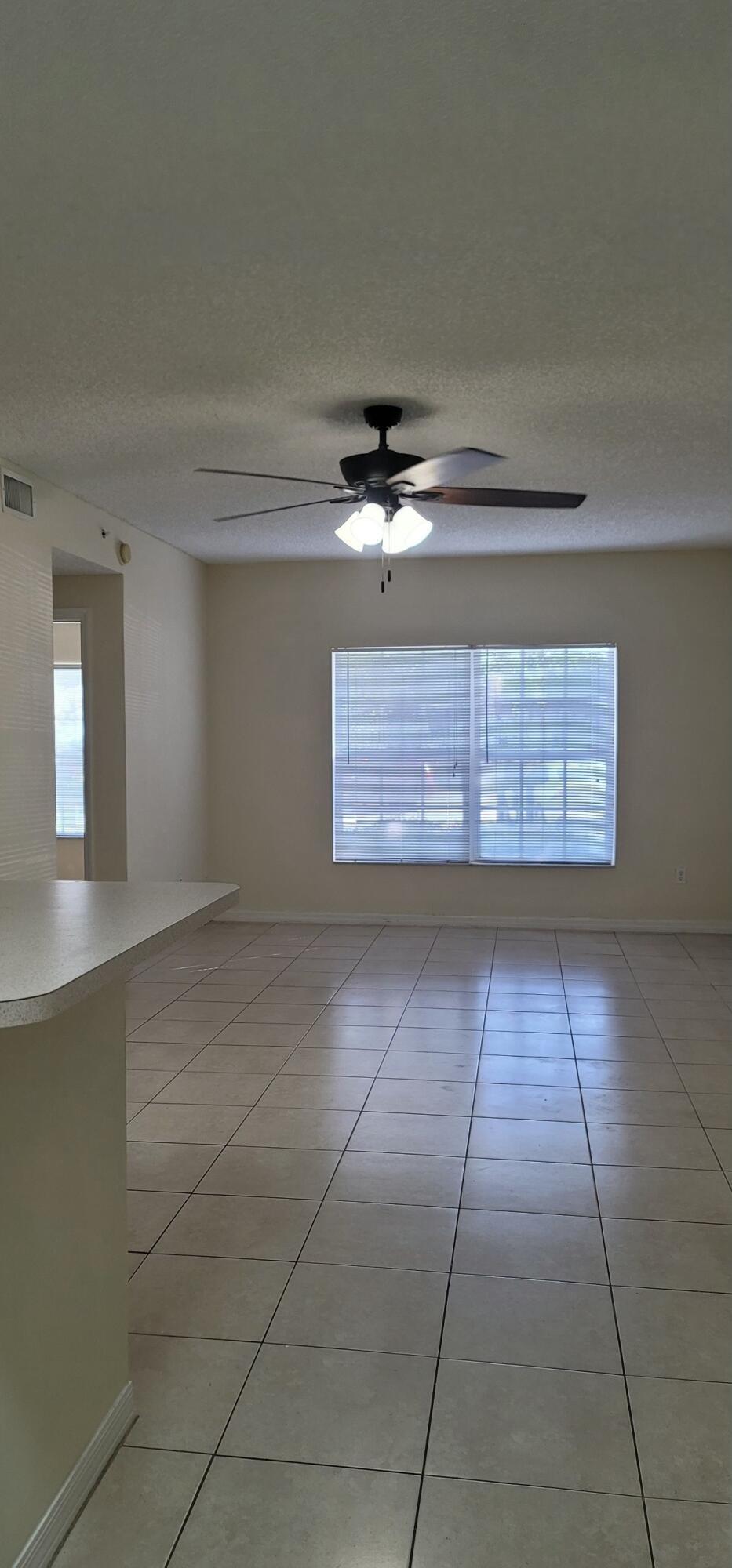5032 Lantana Road, Unit 2105 Lake Worth, FL 33463 - Photo 7 of 15 a view of an empty room with a window