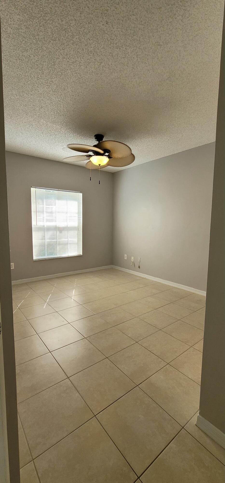 5032 Lantana Road, Unit 2105 Lake Worth, FL 33463 - Photo 9 of 15 a view of a room with an empty space and a window