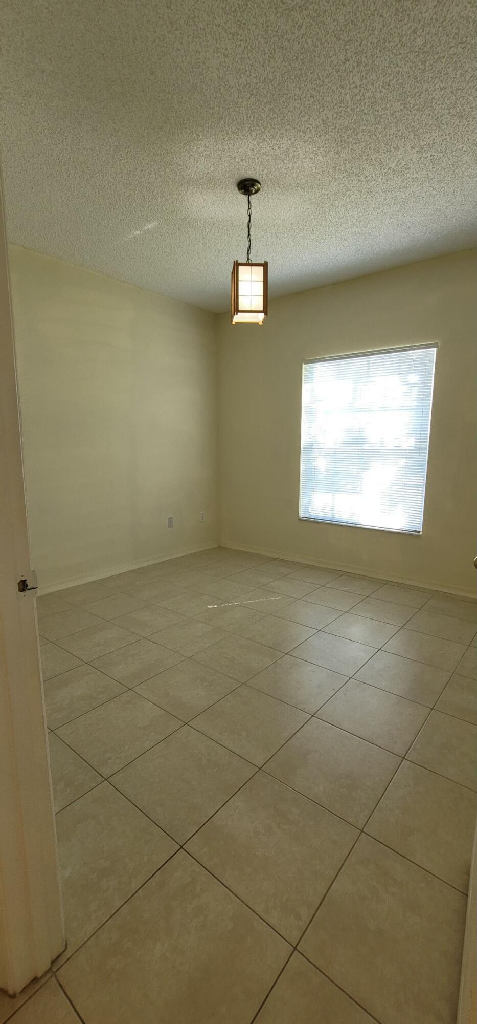 5032 Lantana Road, Unit 2105 Lake Worth, FL 33463 - Photo 10 of 15 a view of a livingroom with window