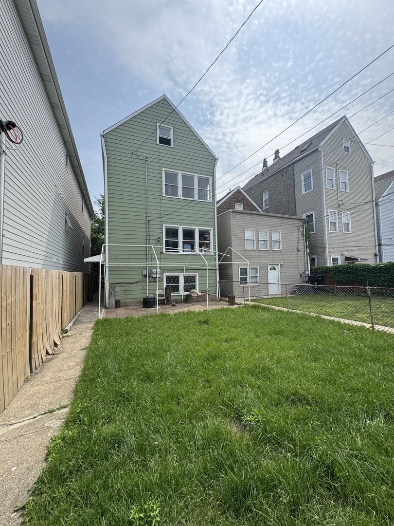 2722 West 23rd Street Chicago, IL 60608 - Photo 2 of 3 a front view of a house with a yard